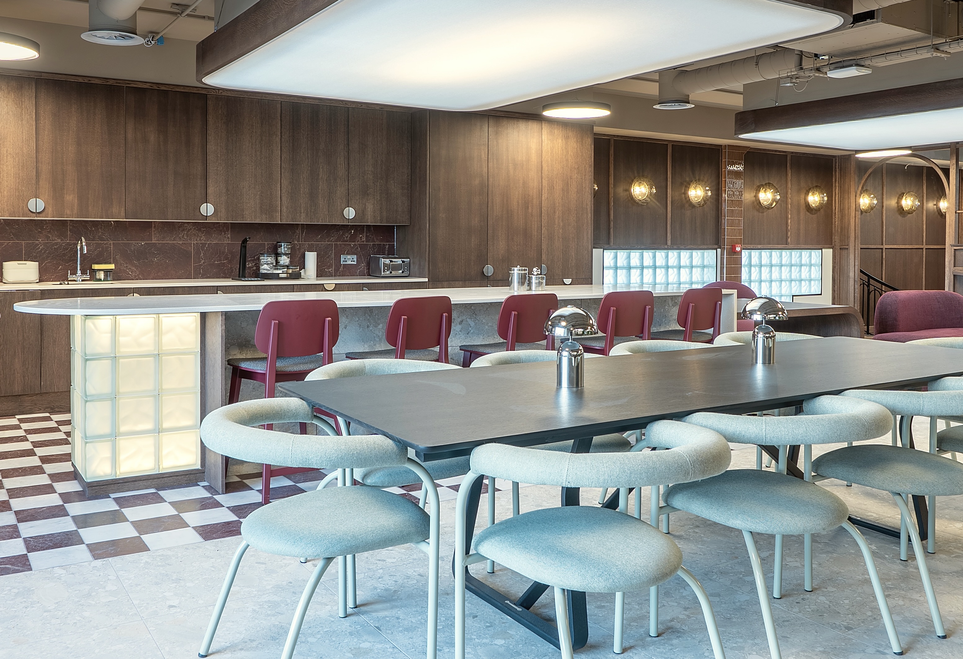 Kitchen and dining area with checkerboard flooring at Runway East, Tottenham Court Road